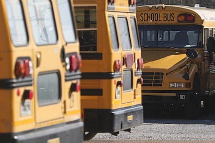 Staff Photo by Dan Henry / The Chattanooga Times Free Press- 2/19/15. The Walker County Schools bus yard in Chickamauga, Ga., on Thursday, February 19, 2015. The district is currently 17 bus drivers short, forcing drivers to make double routes on school days.