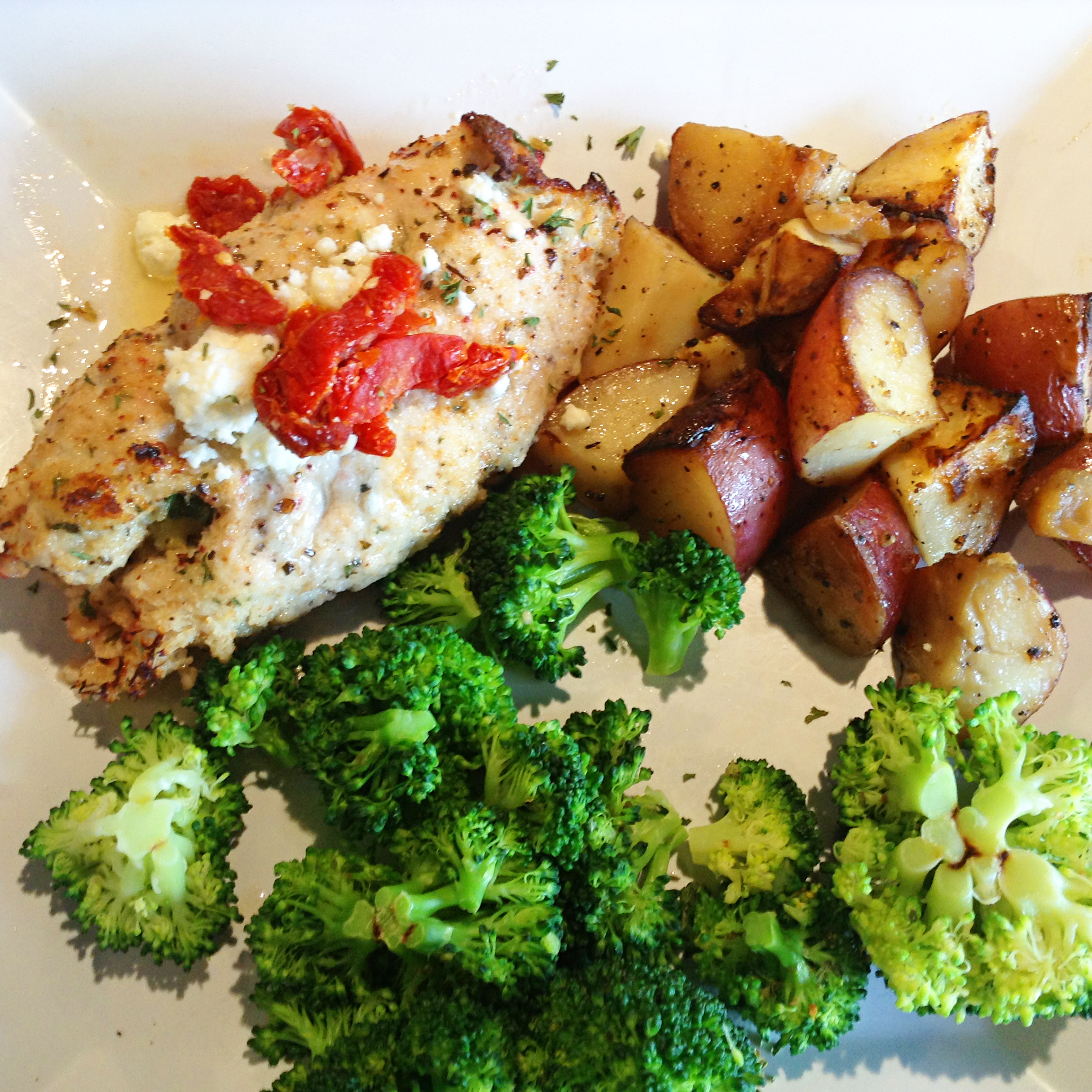 Staff Photo by Chris Zelk / Stevarinos' Mediterranean chicken with roasted red potatoes and steamed broccoli.
