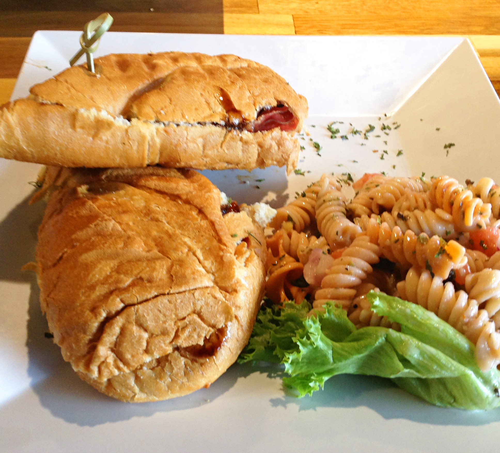Staff Photo by Chris Zelk / Stevarinos' prosciutto panini with pasta salad.