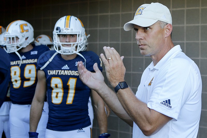 Staff photo by C.B. Schmelter / University of Tennessee at Chattanooga head coach Rusty Wright claps as his players leave the locker room and prepare to take the field for their game against Eastern Illinois at Finley Stadium on Thursday, Aug. 29, 2019 in Chattanooga, Tenn.