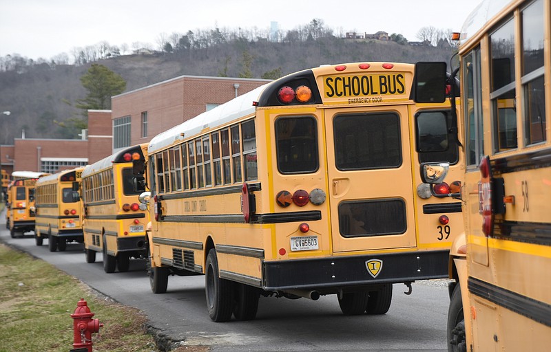 Buses line up after boarding students Monday afternoon at Ringgold High School. Catoosa County schools added 10 minutes to the school day to make up for days lost to weather.