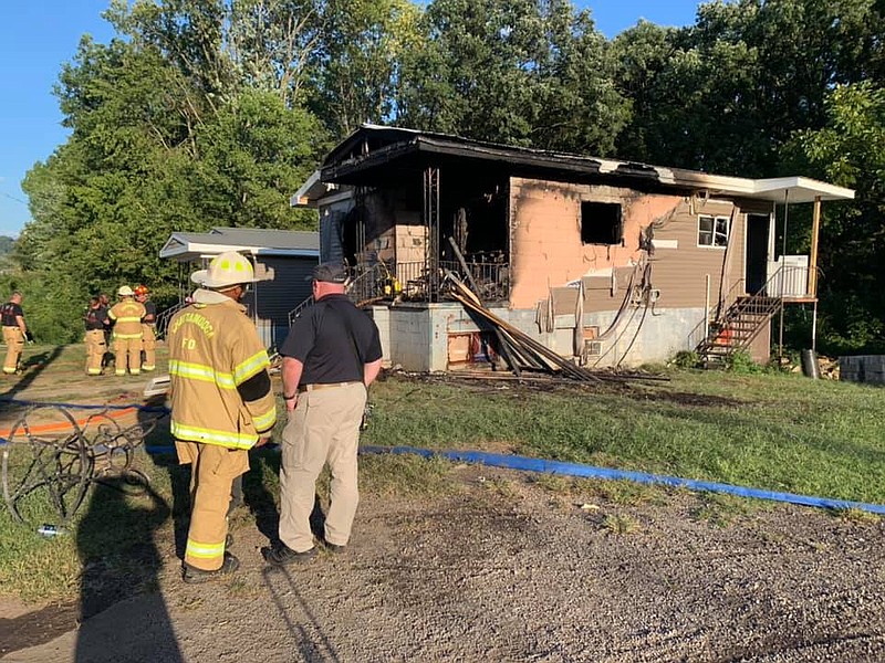 Firefighters assess the scene of a Thursday evening fire in a home on East 36th Street. / Contributed photo/Chattanooga Fire Department