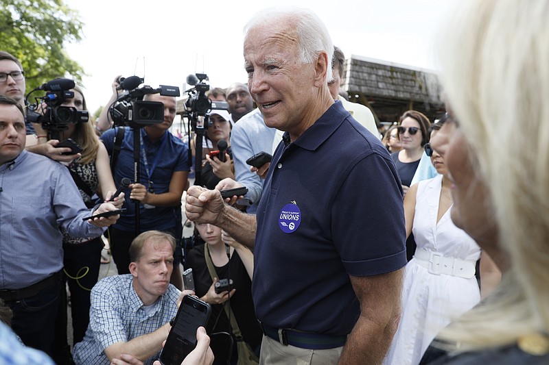 Democratic presidential candidate former Vice President Joe Biden speaks to reporters during the Hawkeye Area Labor Council Labor Day Picnic, Monday, Sept. 2, 2019, in Cedar Rapids, Iowa. (AP Photo/Charlie Neibergall)