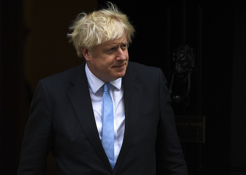 Britain's Prime Minister Boris Johnson walks out 10 Downing Street to greet the US Vice President Mike Pence, in London, Thursday, Sept. 5, 2019.(AP Photo/Alberto Pezzali)