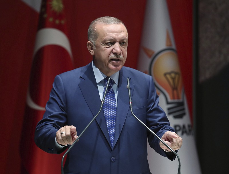 Turkey's President Recep Tayyip Erdogan speaks to his ruling party officials, in Ankara, Turkey, Thursday, Sept. 5, 2019. Erdogan has threatened to allow Syrian refugees in Turkey to travel toward the West unless a so-called safe zone in Syria is established. Erdogan also said Turkey was determined to create a safe zone and would act alone if no agreement is reached on the issue with the United States by the end of the month. (Presidential Press Service via AP, Pool)