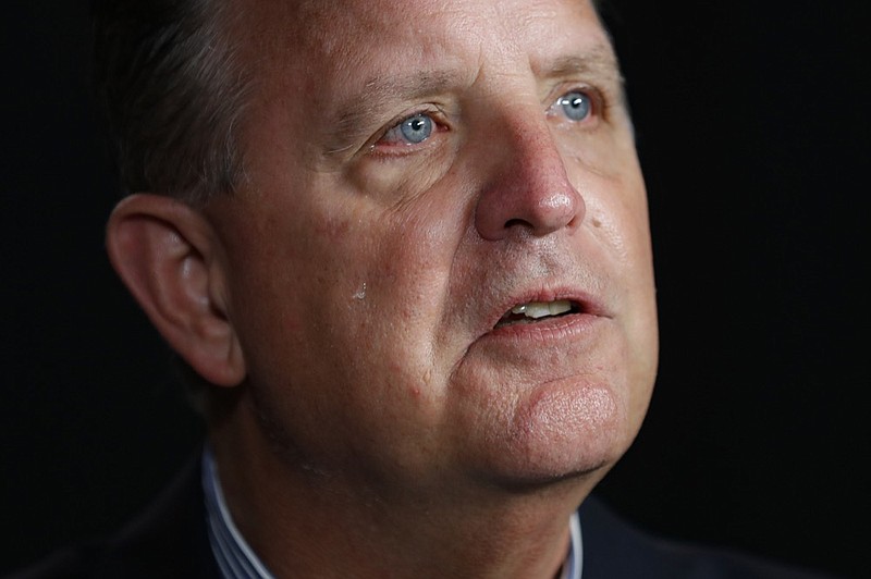 Larry Newcomer cries as he speaks during an interview with The Associated Press, Monday, Aug. 26, 2019, in Cincinnati. Newcomer's older brother Richard was killed during a shooting Sept. 6, 2018, in downtown Cincinnati. (AP Photo/John Minchillo)