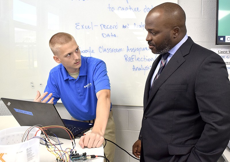 Staff Photo by Robin Rudd/  Red bank sophomore Taylor Turner explains a experiment to Hamilton County Superintendent Dr. Bryan Johnson.  Congressman Chuck Fleischmann and other officials toured the Future Ready classroom at Red Bank High school to view the implementation of successful computer science literacy programs on September 6, 2019.  Earlier in the day there was also a tour of programs at Girls Leadership Academy and later a roundtable discussion at the Edney Innovation Center.   