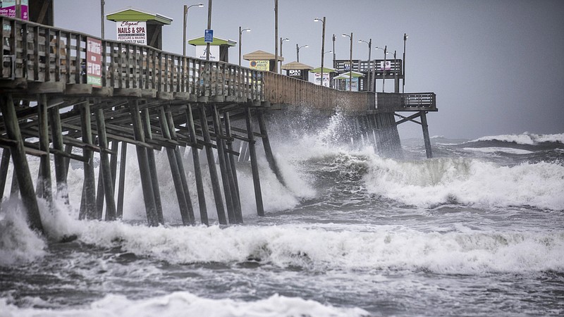 Waves pound the Bogue Inlet Fishing Pier in Emerald Isle, N.C.,as Hurricane Dorian moves north off the coast. (Julia Wall/The News & Observer via AP)