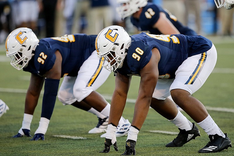 Staff photo by C.B. Schmelter / UTC defensive lineman Devonnsha Maxwell (90) gets ready for a snap against Eastern Illinois during the season opener for both teams Aug. 29 at Finley Stadium.