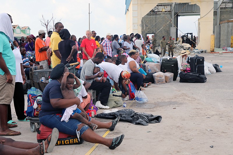 People wait in Marsh Harbour Port to be evacuated to Nassau, in Abaco, Bahamas, Friday.
