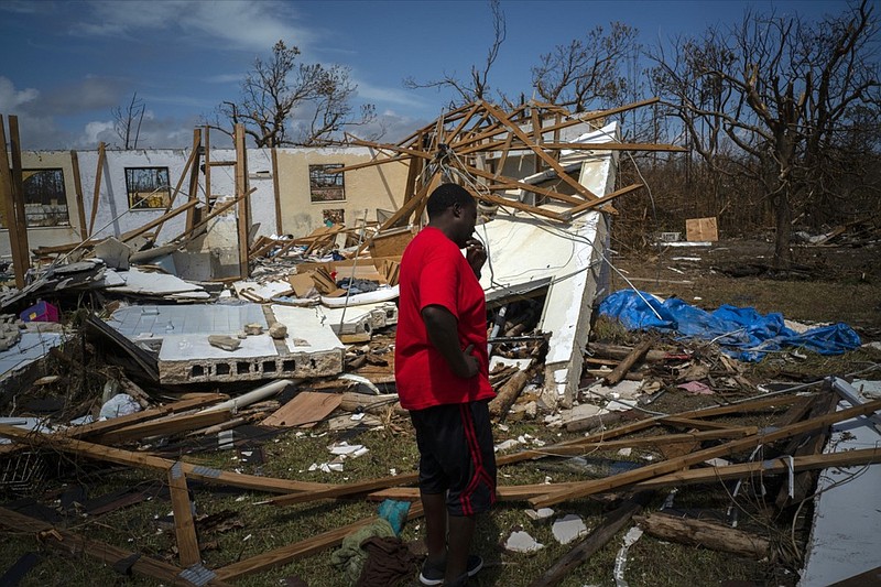 A man cries after discovering his shattered house and not knowing anything about his 8 relatives who lived in the house missing after Hurricane Dorian in High Rock, Grand Bahama, Bahamas, Thursday Sept. 5, 2019. (AP Photo / Ramon Espinosa)