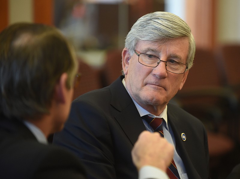 Staff Photo by Angela Lewis Foster Sen. Todd Gardenhire, right, listens to Sen. Bo Watson Tuesday, January 5, 2016 at the Chattanooga Times Free Press.