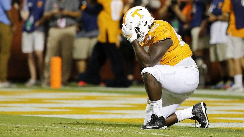 Staff photo by C.B. Schmelter / Tennessee defensive lineman Greg Emerson reacts after BYU scored the game-winning touchdown in double overtime Saturday night at Neyland Stadium.