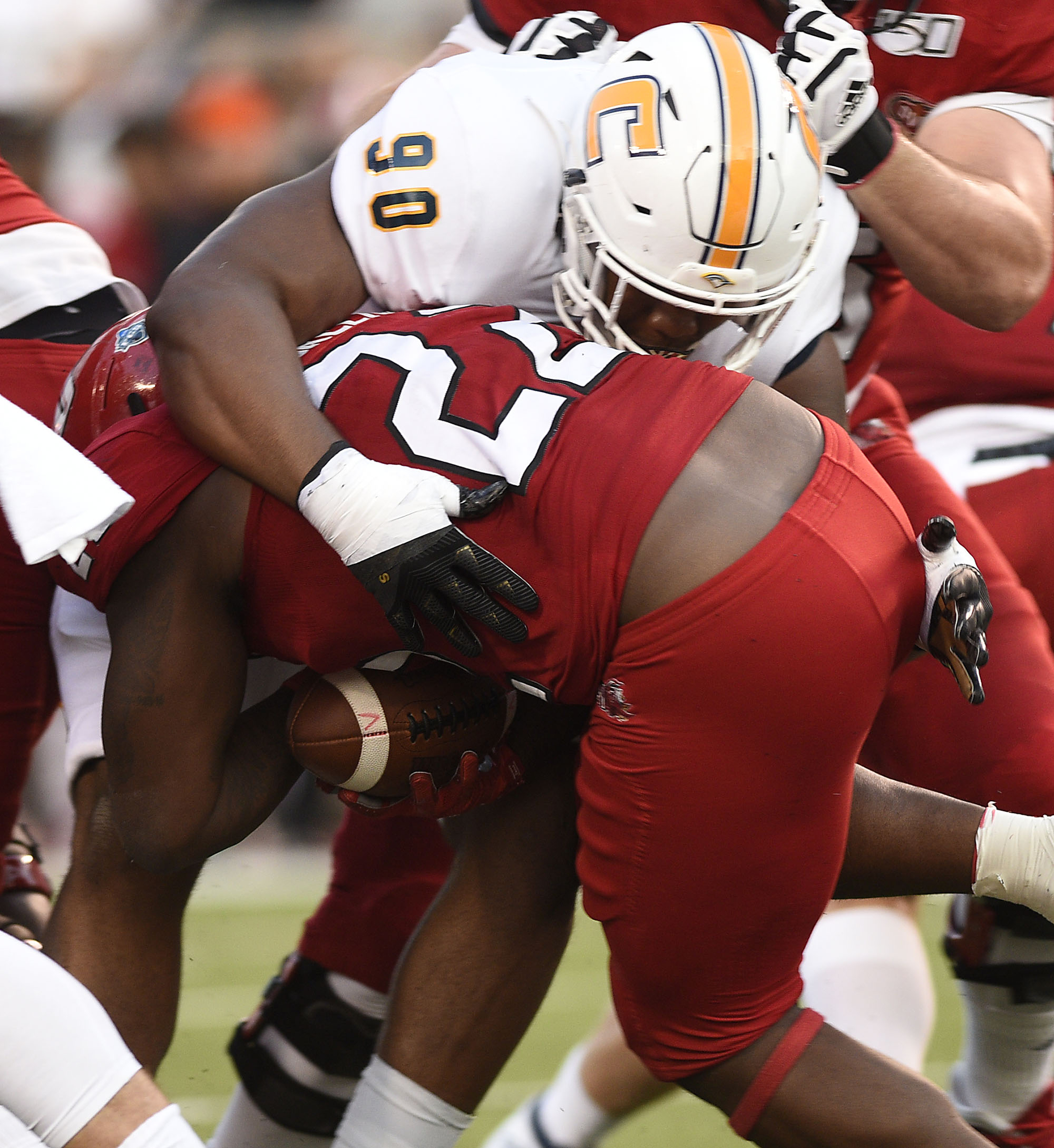 Staff Photo by Robin Rudd/ UTC's Devonnsha Maxwell (90) stops Jacksonville's Jaelen Greene (22). The University of Tennessee Chattanooga Mocs visited the Jacksonville State Gamecocks in NCAA football action on September 7, 2019.