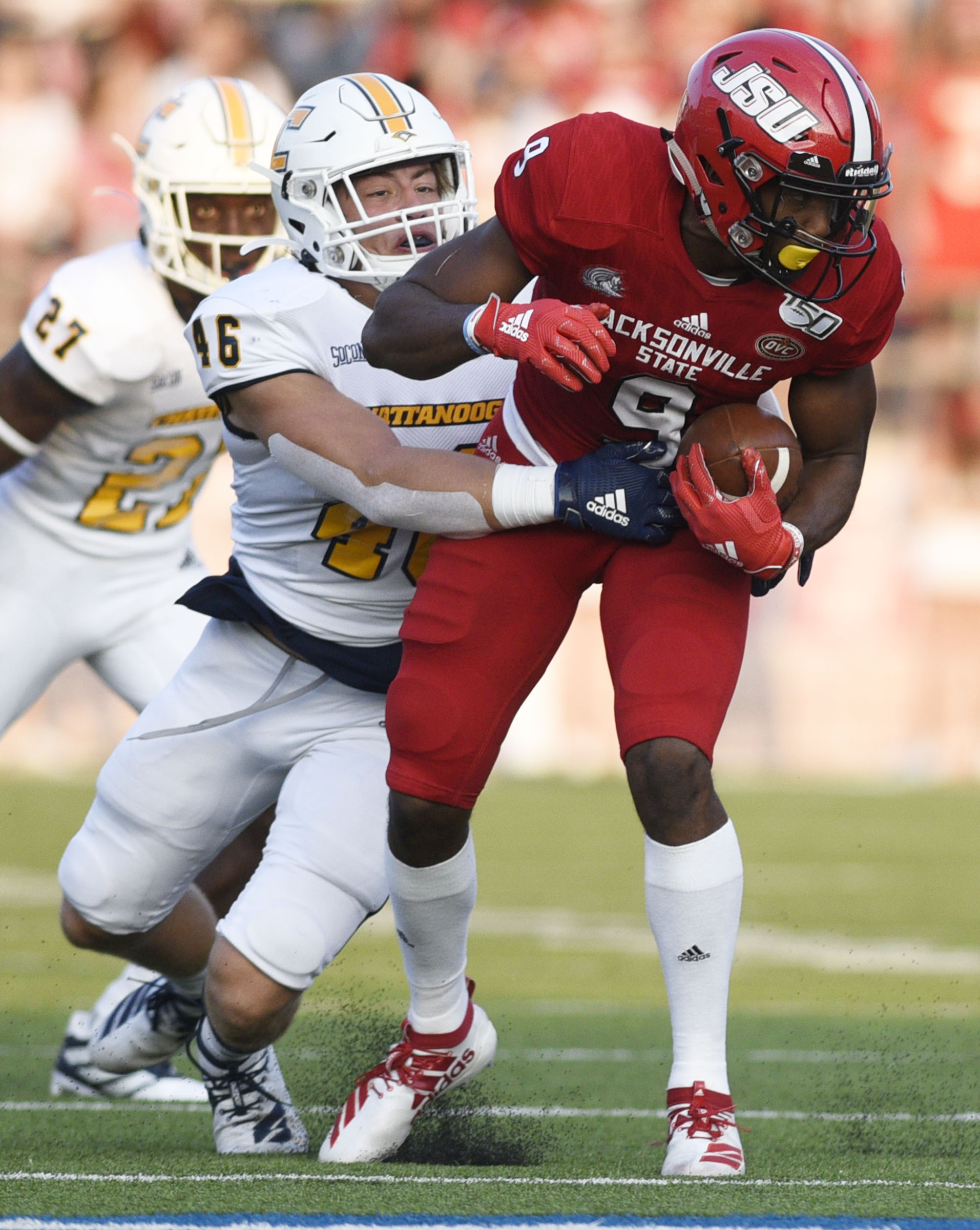 Staff Photo by Robin Rudd/ UTC's Ty Boeck (46) brings down Jacksonville's Daniel Byrd (9). The University of Tennessee Chattanooga Mocs visited the Jacksonville State Gamecocks in NCAA football action on September 7, 2019.