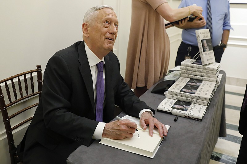 Photo by Richard Drew of The Associated Press/Former U.S. Secretary of Defense Jim Mattis signs copies of his book after he spoke at the Council on Foreign Relations in New York last Tuesday.