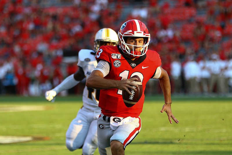 Georgia backup quarterback Stetson Bennett had two touchdown passes and this 1-yard rushing score during last Saturday's 63-17 drubbing of Murray State. / Georgia photo by Tony Walsh