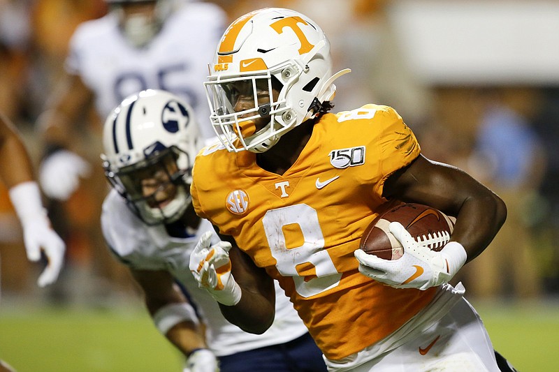 Staff photo by C.B. Schmelter / Tennessee running back Ty Chandler (8) carries agaisnt BYU during an NCAA football game at Neyland Stadium on Saturday, Sept. 7, 2019 in Knoxville, Tenn.