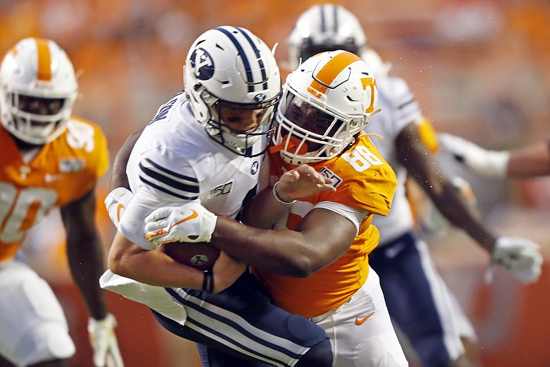 Tennessee defensive lineman LaTrell Bumphus (88) sacks Brigham Young quarterback Zach Wilson (1) for a loss in the first half of an NCAA college football game Saturday, Sept. 7, 2019, in Knoxville, Tenn. (AP Photo/Wade Payne)
