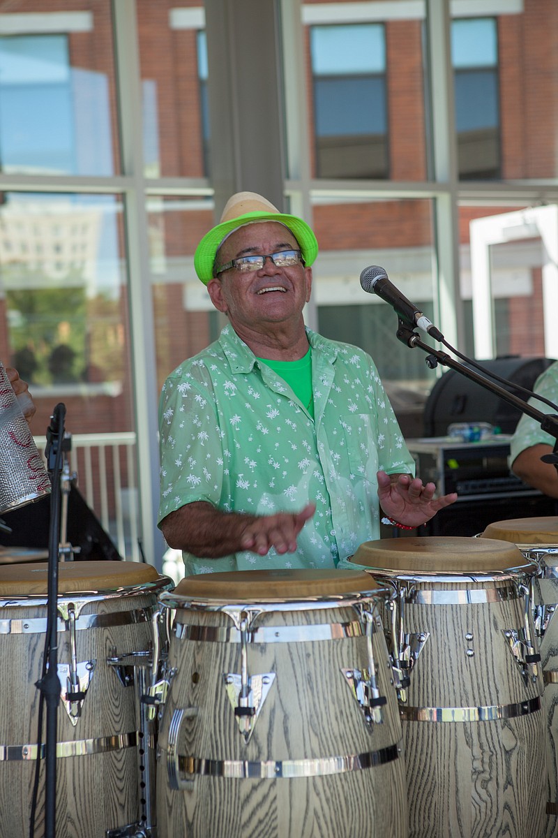 River City Co. Contributed Photo / Carlos Colon, shown, and his Tropical Swing Band have played a decade's worth of salsa-inspired performances across town. Colon plays the conga drum and other Latin percussion instruments. The band includes piano, brass, bass, electric guitar, maracas, bongos and more.