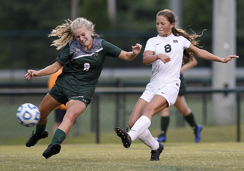 Staff Photo by Robin Rudd/  Notre Dame's Kenzie Campbell (8) fires a shot past Silverdale's McKinzie Marcus (8).  The Silverdale Academy Lady Seahawks hosted the Notre Dame Lady Fighting Irish in TSSAA soccer action on September 10, 2019.  