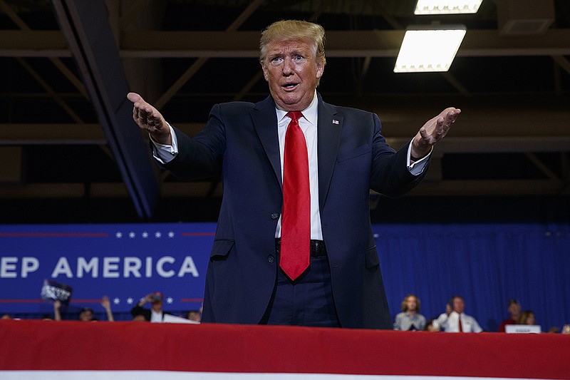 President Donald Trump arrives on stage at the Crown Expo for a campaign rally, Monday, Sept. 9, 2019, in Fayetteville, N.C. (AP Photo/Evan Vucci)