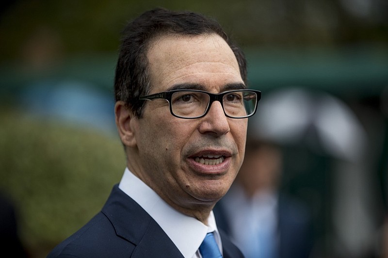 In this Spet. 9, 2019, photo, Treasury Secretary Steve Mnuchin speaks to reporters outside the West Wing of the White House in Washington. Trump administration officials are coming before Congress to defend their plan for ending government control of Fannie Mae and Freddie Mac, the giant mortgage finance companies that nearly collapsed in the financial crisis 11 years ago and were bailed out at cost to taxpayers of $187 billion. Treasury Mnuchin and Housing and HUD Secretary Ben Carson are testifying Sept. 10 before the Senate Banking Committee on the plan for returning Fannie and Freddie to private ownership. (AP Photo/Andrew Harnik)


