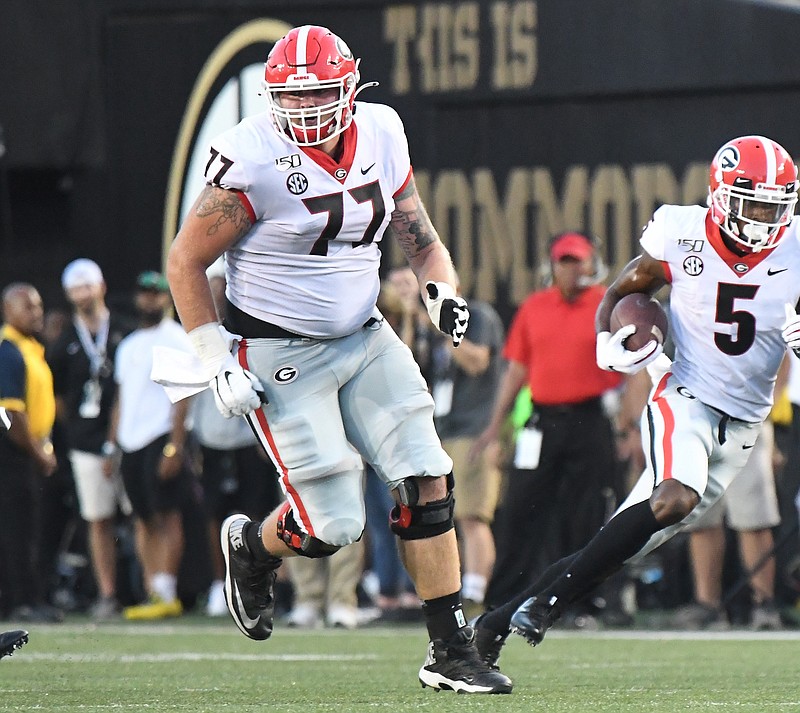Georgia photo by Perry McIntyre / Offensive lineman Cade Mays looks for someone to block as receiver Matt Landers runs with the ball during Georgia's 30-6 opening win at Vanderbilt on Aug. 31.