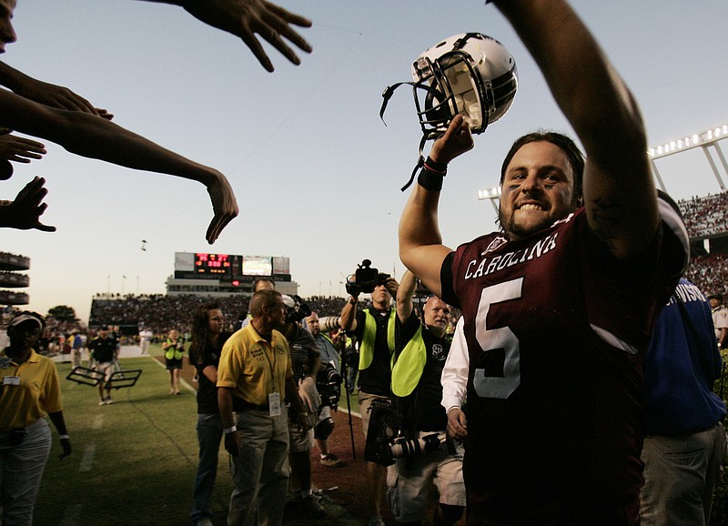 Associated Press photo by Mary Ann Chastain / South Carolina quarterback Stephen Garcia celebrates as he leaves the field after the Gamecocks beat top-ranked Alabama 35-21 on Oct. 9, 2010, at Williams Brice Stadium in Columbia, S.C.