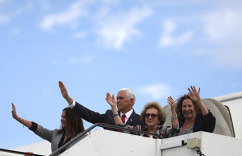 U.S. Vice President Mike Pence and members of his family, his wife Karen Pence, left, mother Nancy Pence-Fritsch, and sister Ann Poynter, right, wave goodbye as they board Air Force Two at Dublin airport Ireland, on Sept. 3, 2019. Pence had meetings with Irish Prime Minister Leo Varadkar in Dublin but traveled daily 180 miles to stay overnight at Donald Trump's resort on the other side of the country. (AP Photo/Peter Morrison)