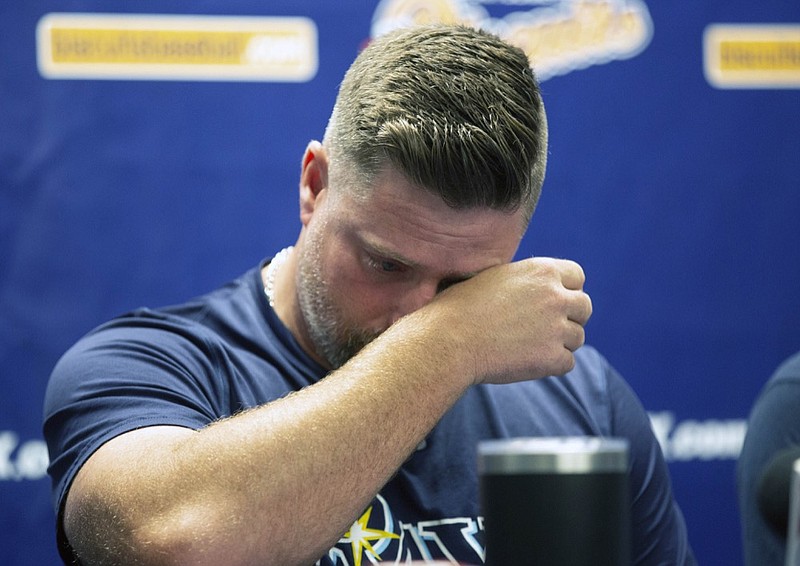 Montgomery Biscuits manager Morgan Ensberg wipes away tears during a news conference about pitcher Blake Bivens' wife and child who were killed in a triple homicide, Thursday, Aug. 29, 2019 in Montgomery, Ala. A Virginia man appears to have used a .30-30 rifle and a sledgehammer in a deadly rampage that claimed the lives of minor league baseball player Blake Biven's wife, 1-year-old son and mother-in-law, according to court documents released Thursday. (Kirsten Fiscus/Montgomery Advertiser via AP)


