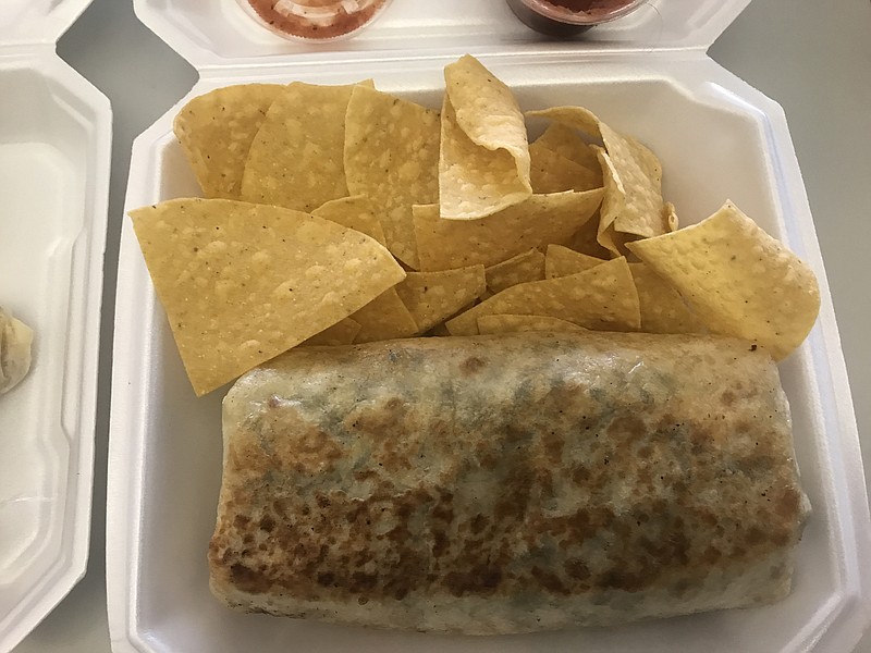 Diners at Mr. Burrito Grill choose their own ingredients such as black beans, rice, melted white cheese, grated Mexican cheese, spinach, chipotle chicken, sour cream and avocado in this hefty burrito. Tamales come with a side of salsa verde.