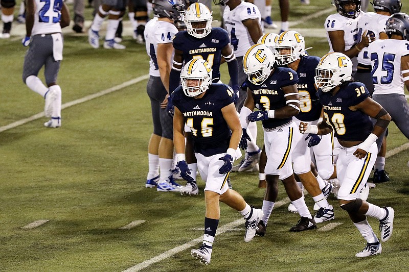 Staff photo by C.B. Schmelter / UTC linebacker Ty Boeck (46) celebrates after a stop on a kickoff return during the Mocs' season-opening win against Eastern Illinois on Aug. 29 at Finley Stadium.