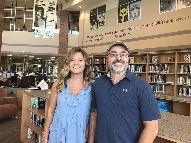 Staff photo by Sabrina Bodon / Buffy Hemphill and Mark Collins pose for a photo at Heritage High School, the headquarters of the Catoosa County Schools Partnership Program which is in need of volunteer mentors.