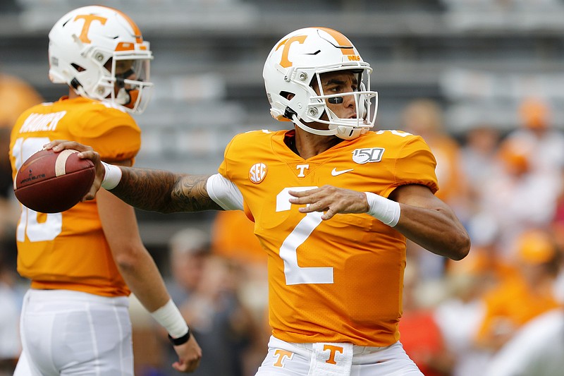 Staff photo by C.B. Schmelter / Tennessee quarterback Jarrett Guarantano warms up for last Saturday's home game against UTC.