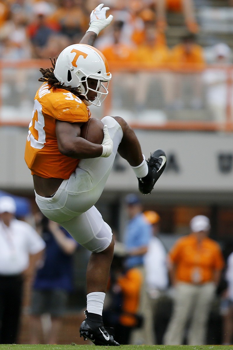Staff photo by C.B. Schmelter / Tennessee linebacker Jeremy Banks (33) comes down with an interception against UTC during a NCAA football game at Neyland Stadium on Saturday, Sept. 14, 2019 in Knoxville, Tenn.
