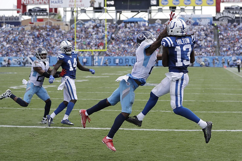 Associated Press photo by James Kenney / Indianapolis Colts wide receiver T.Y. Hilton catches a touchdown pass while closely covered by Tennessee Titans cornerback Malcolm Butler for the go-ahead touchdown Sunday afternoon in Nashville. The Colts won 19-17 for their 14th victory in their past 16 games against the Titans.