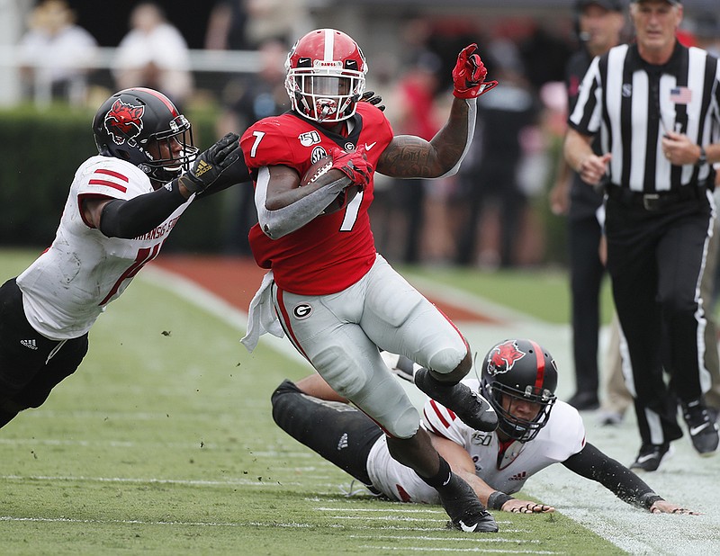 Atlanta Journal-Constitution photo by Bob Andres via The Associated Press / Georgia running back D'Andre Swift turns the corner and heads toward the end zone for a touchdown catch during Saturday's game against Arkansas State.