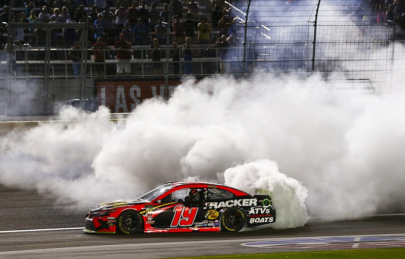 Associated Press photo by Chase Stevens / Martin Truex Jr. celebrates his victory Sunday at Las Vegas Motor Speedway with a burnout.