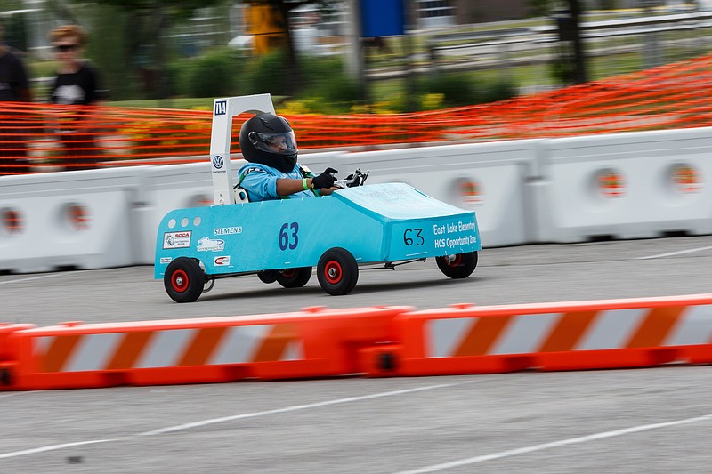 The East Lake Speedy Eagles car competes in a race in the 2019 Chattanooga Green Prix at Chattanooga State Technical Community College on Friday, May 10, 2019, in Chattanooga, Tenn. Teams from schools across Hamilton County and the Southeast competed in the electric go-cart races, which test teams' mechanical abilities, driving skill and their cart's endurance.