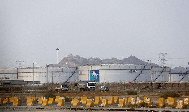 Storage tanks are seen at the North Jiddah bulk plant, an Aramco oil facility, in Jiddah, Saudi Arabia, Sunday, Sept. 15, 2019. The weekend drone attack in Buqyaq on one of the world's largest crude oil processing plants that dramatically cut into global oil supplies is the most visible sign yet of how Aramco's stability and security is directly linked to that of its owner -- the Saudi government and its ruling family. (AP Photo/Amr Nabil)