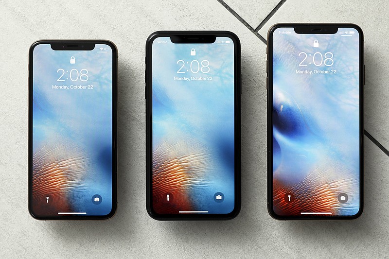 FILE - This Oct. 22, 2018, file photo shows the iPhone XS, from left, iPhone XR, and the iPhone XS Max in New York. Apple on Tuesday, Sept. 17, 2019, deepened its ties with a Kentucky manufacturing plant by awarding $250 million to support Corning Inc.’s continued work to develop glass for iPhones and other devices. The award builds on the $200 million that Corning received from Apple’s Advanced Manufacturing Fund in 2017, the tech giant said.  (AP Photo/Richard Drew, File)