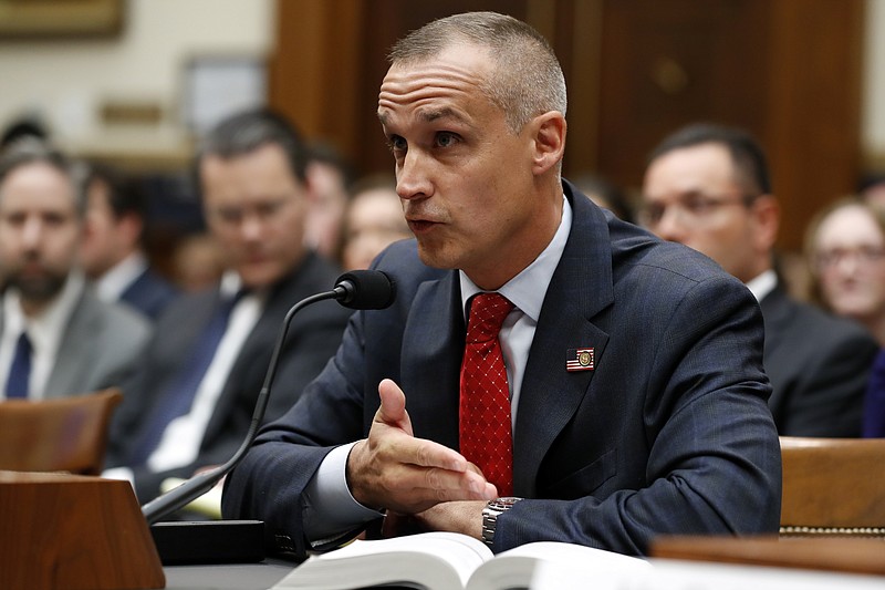 Corey Lewandowski, former campaign manager for President Donald Trump, references a copy of the Mueller Report that he requested to be brought to him, as he testifies to the House Judiciary Committee Tuesday, Sept. 17, 2019, in Washington. (AP Photo/Jacquelyn Martin)