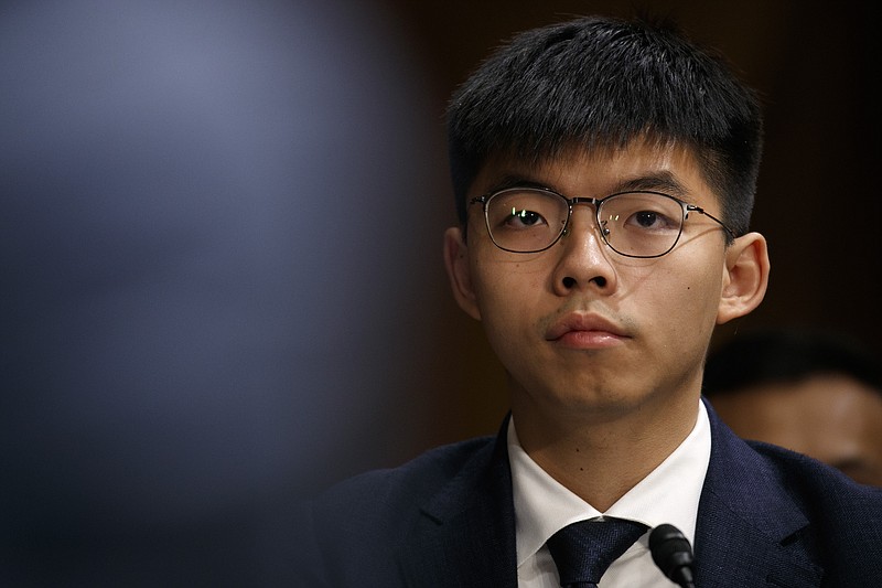 Hong Kong activist Joshua Wong, listens during a congressional hearing on the Hong Kong protests, Tuesday, Sept. 17, 2019, on Capitol Hill in Washington. (AP Photo/Jacquelyn Martin)