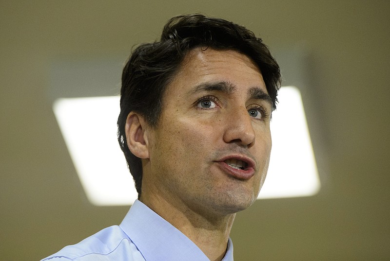 In this Tuesday, Sept. 17, 2019, photo, Canadian Prime Minister and Liberal leader Justin Trudeau makes a campaign stop in St. John's, Newfoundland and Labrador, Canada. Trudeau's campaigning for national elections has been hit by the publication of a yearbook photo showing him in "brownface" makeup at a costume party in 2001. (Sean Kilpatrick/The Canadian Press via AP)