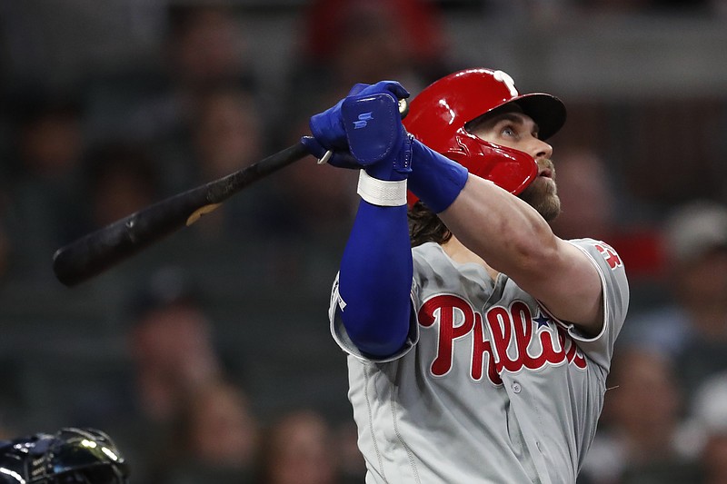 Associated Press photo by John Bazemore / Philadelphia Phillies right fielder Bryce Harper follows through on a two-run homer in the fourth inning of Wednesday night's game against the host Atlanta Braves.