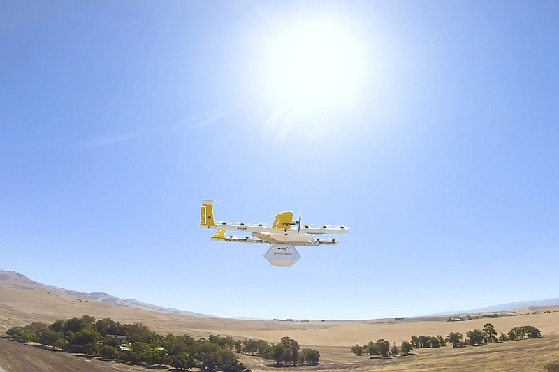 This undated image made from video provided in September 2019 by Wing, a member of the Alphabet family of companies, shows a delivery drone test which is part of a partnership with Walgreens. On Thursday, Sept. 19, 2019, Walgreens and the Google affiliate said they are testing drone deliveries that can put drugstore products on customer doorsteps minutes after being ordered. (Wing via AP)
