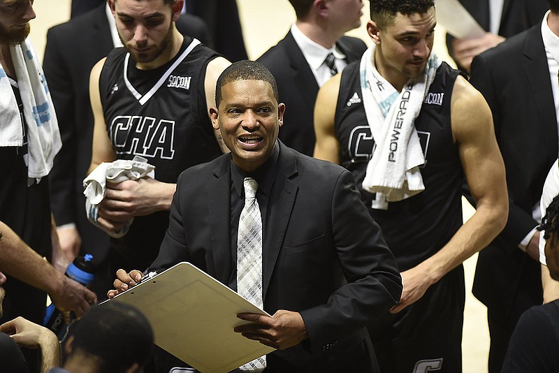 Staff Photo by Robin Rudd / UTC men's basketball coach Lamont Paris gathers his players during a timeout in their SoCon game against UNC Greensboro on Feb. 9 at McKenzie Arena. Paris has received a two-year contract extension through the 2024-25 season, the school announced Thursday.