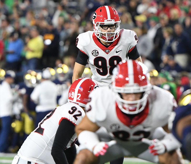 Georgia photo by Perry McIntyre / Georgia kicker Rodrigo Blankenship, rear, made a 30-yard field goal with 3:34 remaining two years ago at Notre Dame to propel the Bulldogs to a 20-19 triumph.