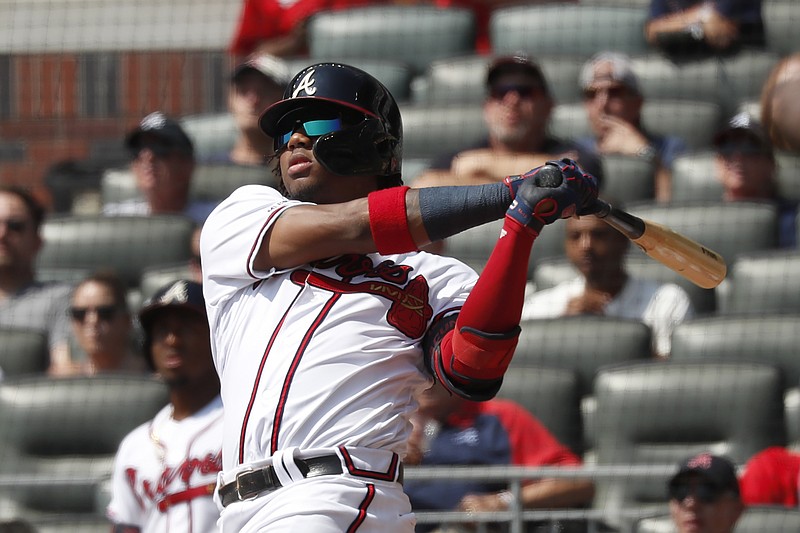 Associated Press photo by John Bazemore / Atlanta Braves center fielder Ronald Acuna Jr. follows through on a two-run homer in the third inning of his team's 5-4 home win against the Philadelphia Phillies on Thursday afternoon. The homer was Acuna's 40th of the season.